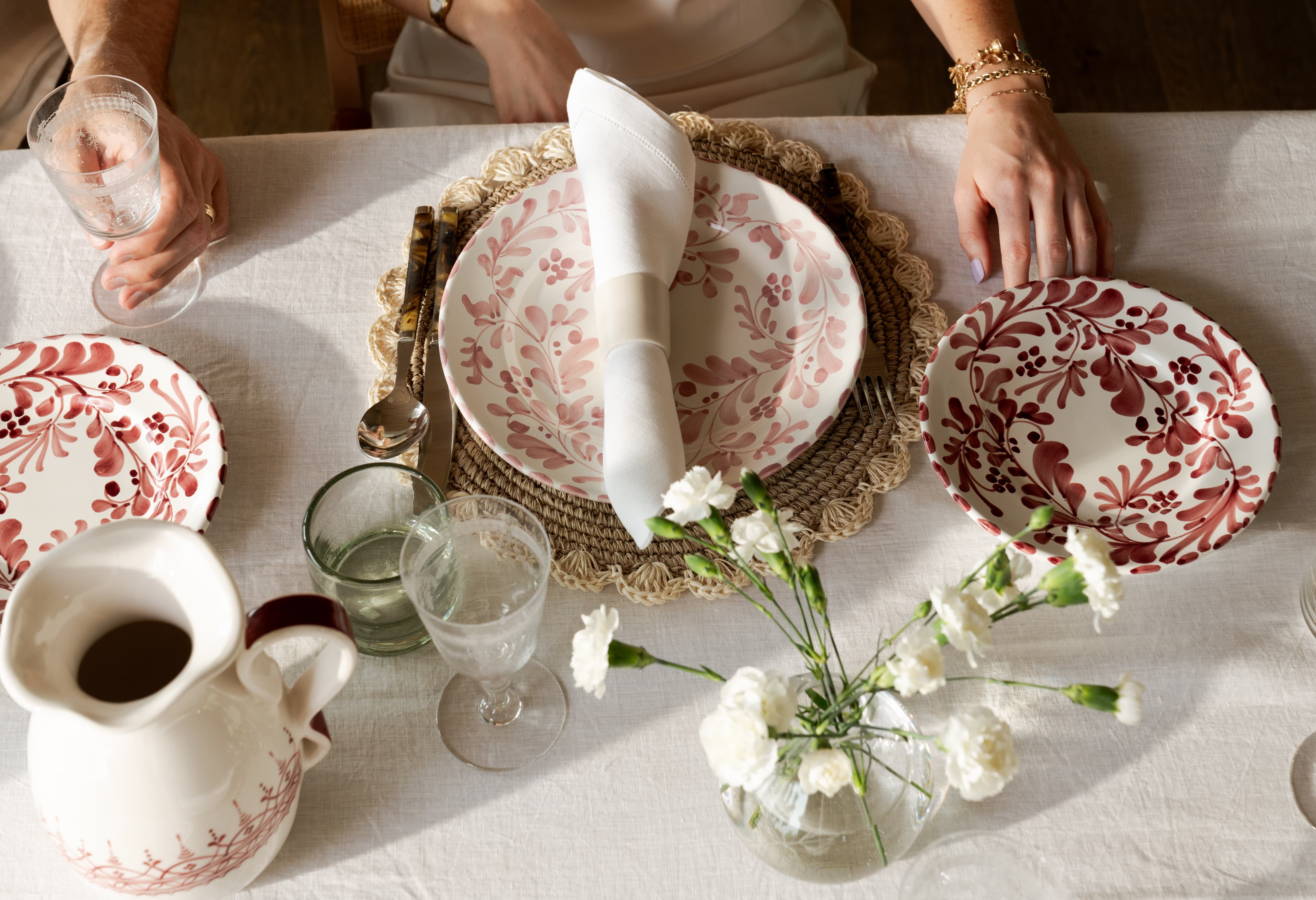 A styled tabletop of artisan wedding registry pieces from Soirée Season